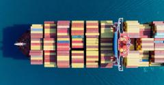 aerial view of a ship carrying shipping containers