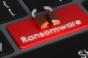 a red button on a keyboard says ransomware