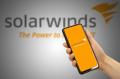 Solarwinds technology logo on smartphone screen in hand
